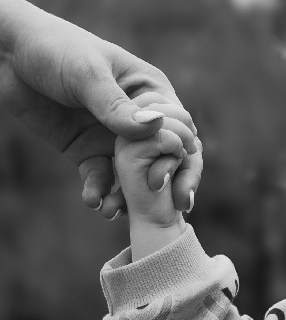 Mother and child holding hands