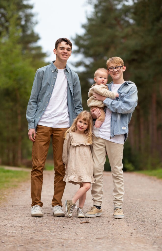 Children posing in the woods