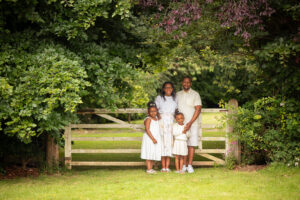 Family in front of a gate