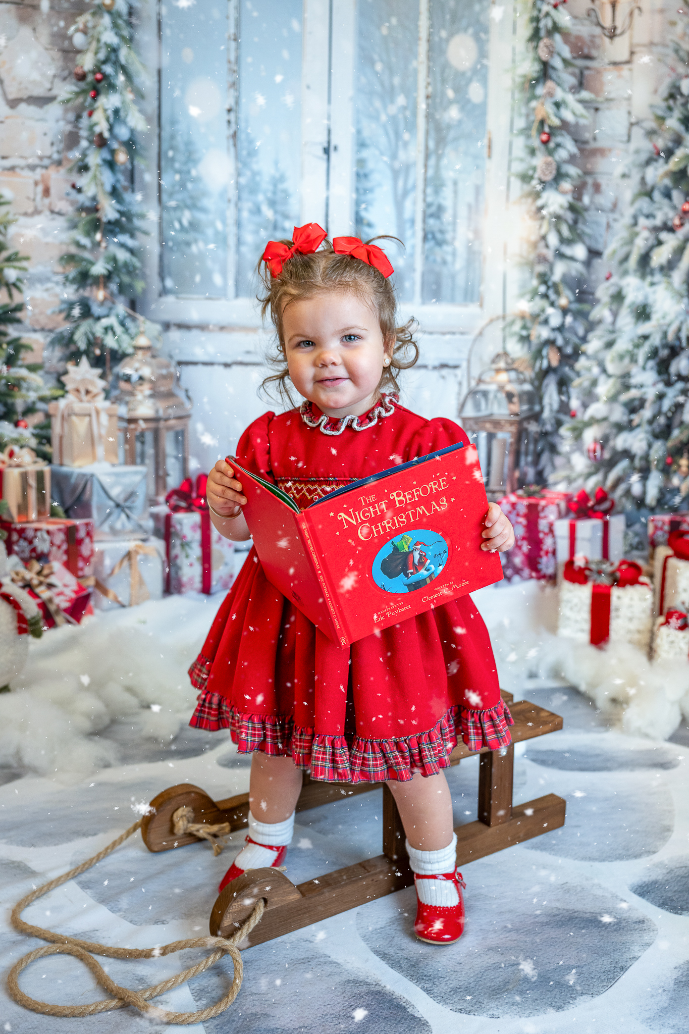 Girl reading a Christmas book