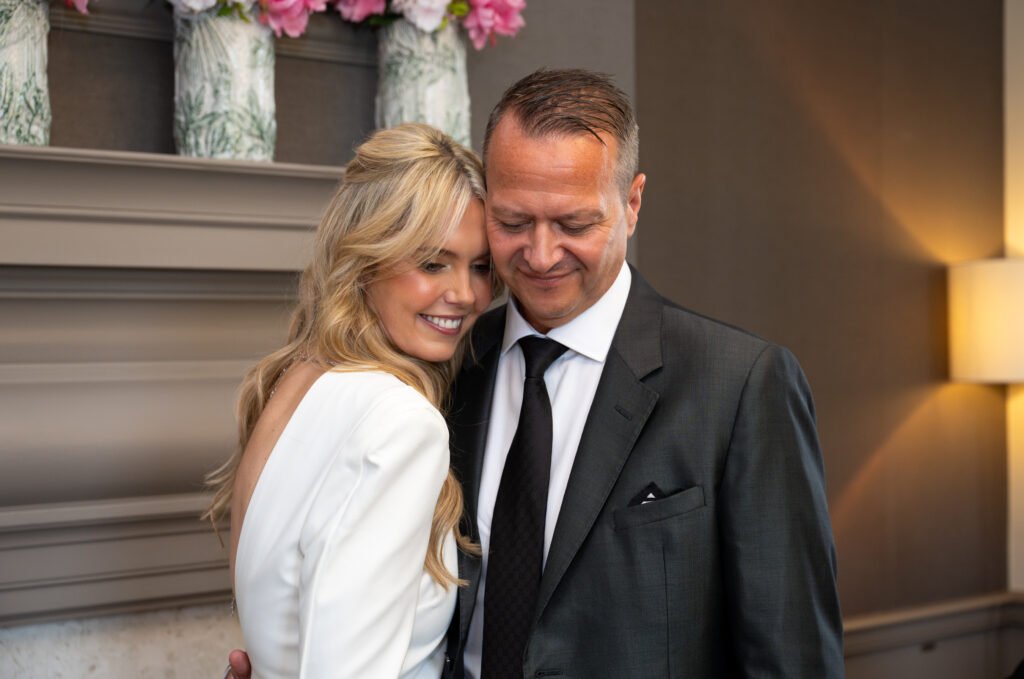 Couple hugging at their wedding ceremony