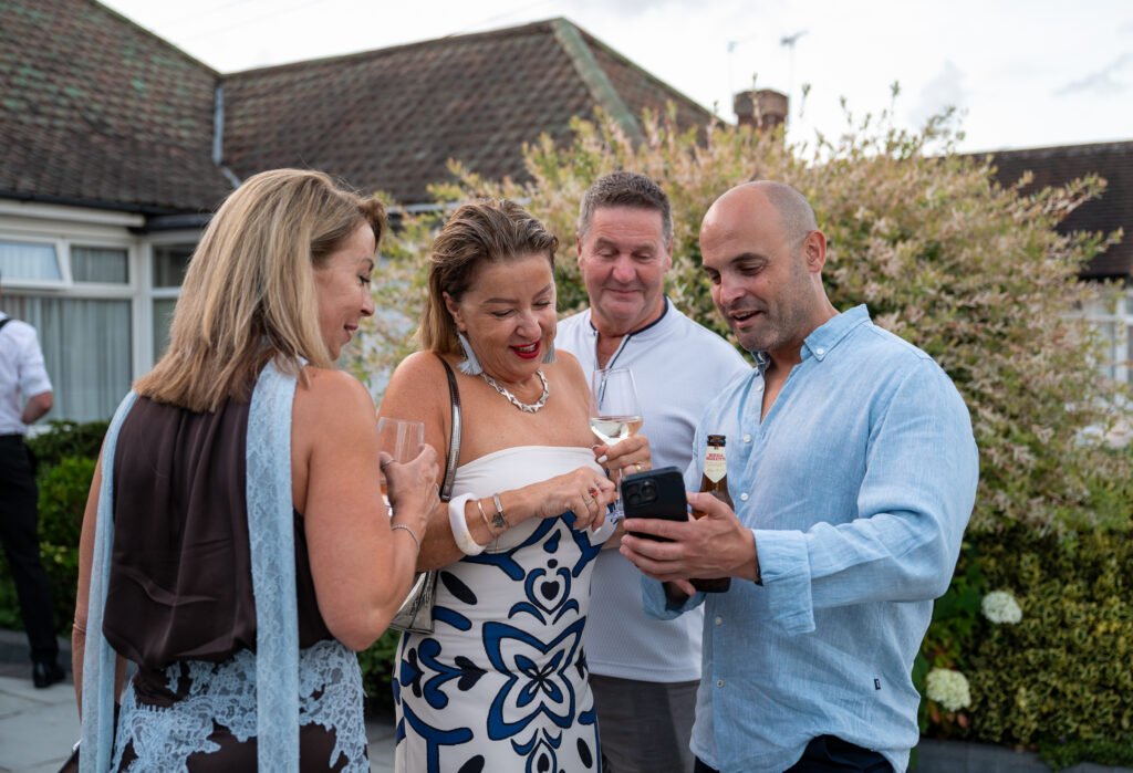Group of people looking at a photo