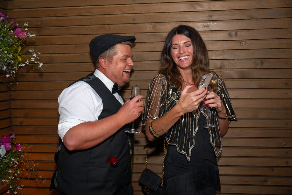Couple laughing at a party