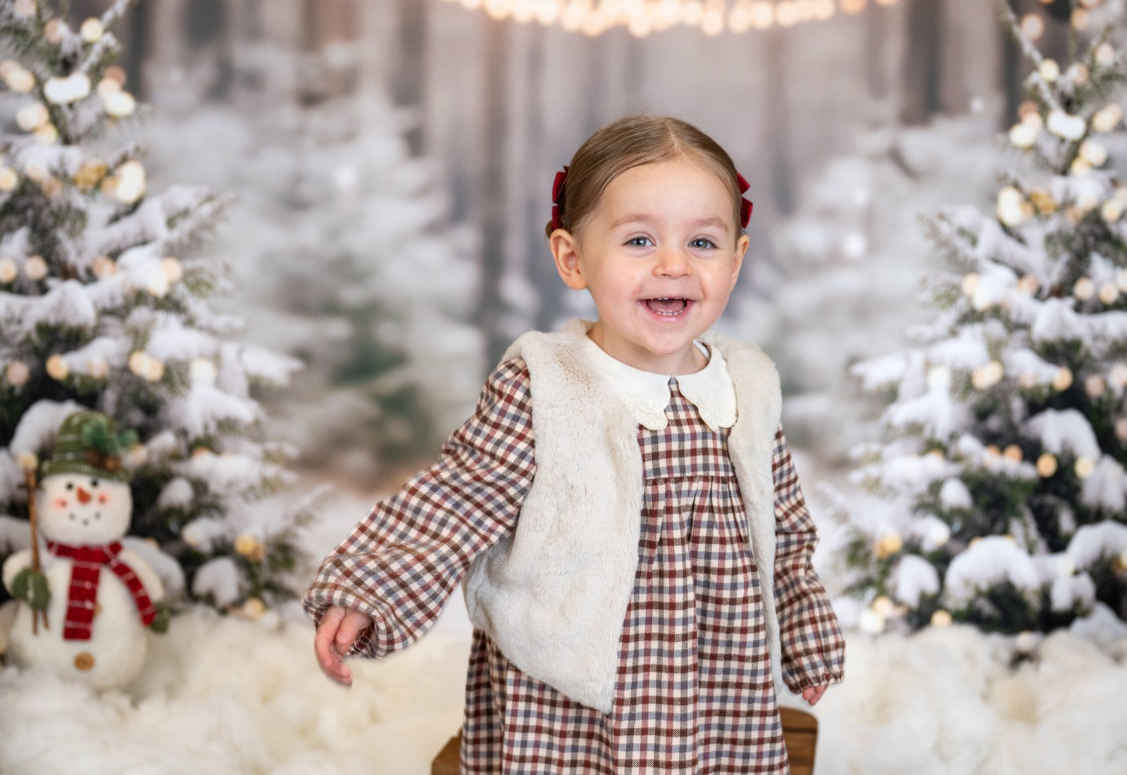 Girl laughing and playing in the snow